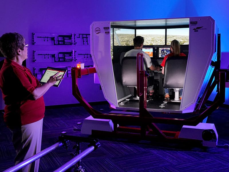 During a CCAC Aviation Program open house, prospective students can participate in a demonstration of one of the college's state-of-the-art flight simulators.