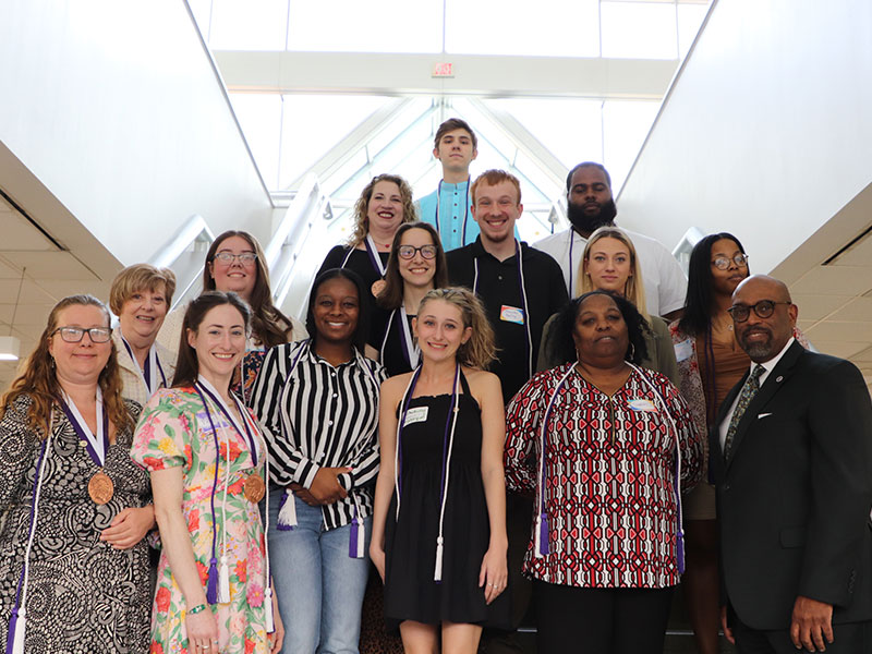 Pictured left to right. Front row: Ahimsa Shakti, Megan Kennedy, Sydney Hubbard, Kayleigh Ferderbar, Sarah Johnson, Dr. Quintin Bullock 2nd row: Cheryl Marszalek, Emily Marlovits, Jenna Beech, Theresa Parks, Rachel Bundy 3rd row: Bridget Sluka, Alexander Dowling, Jaquan Brockman Top: Michael Sipper