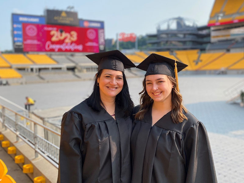 Mother-daughter pair Janine and Alexis Dolanche celebrated in their graduation regalia at the CCAC Commencement.