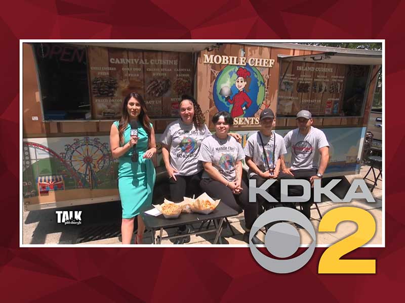 The Gatewood-Campbell family talked about their experiences at CCAC in front of one of their Mobile Chef food trucks.