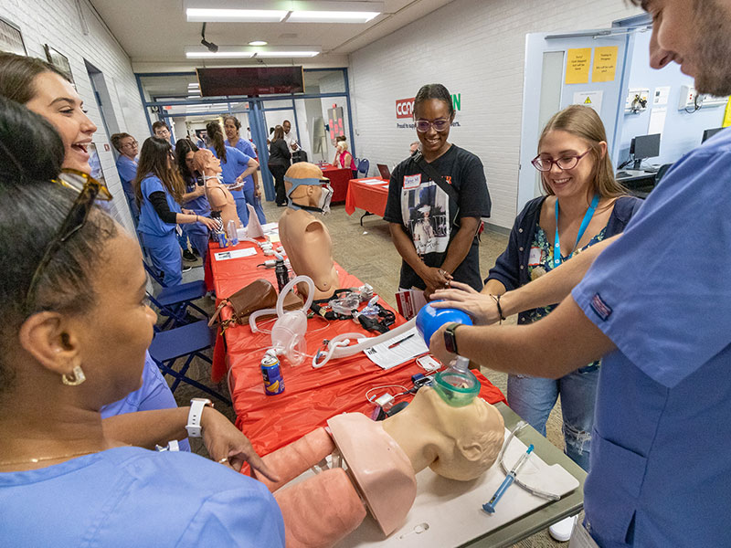 CCAC students talk with visitors at the Allied Health open house held in summer of 2023.