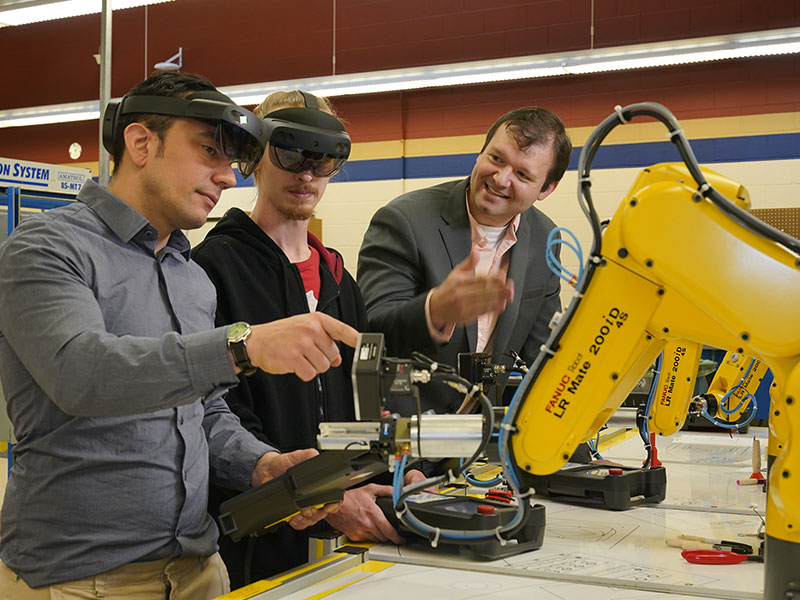 Dr. Justin Starr, far right, says CCAC’s rate of local employment is close to 100% for graduates of their programs.